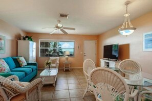 Condo | Living room | Flat-screen TV, DVD player, books