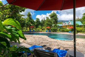 Outdoor pool, open 10:00 AM to 6:00 PM, pool umbrellas, sun loungers