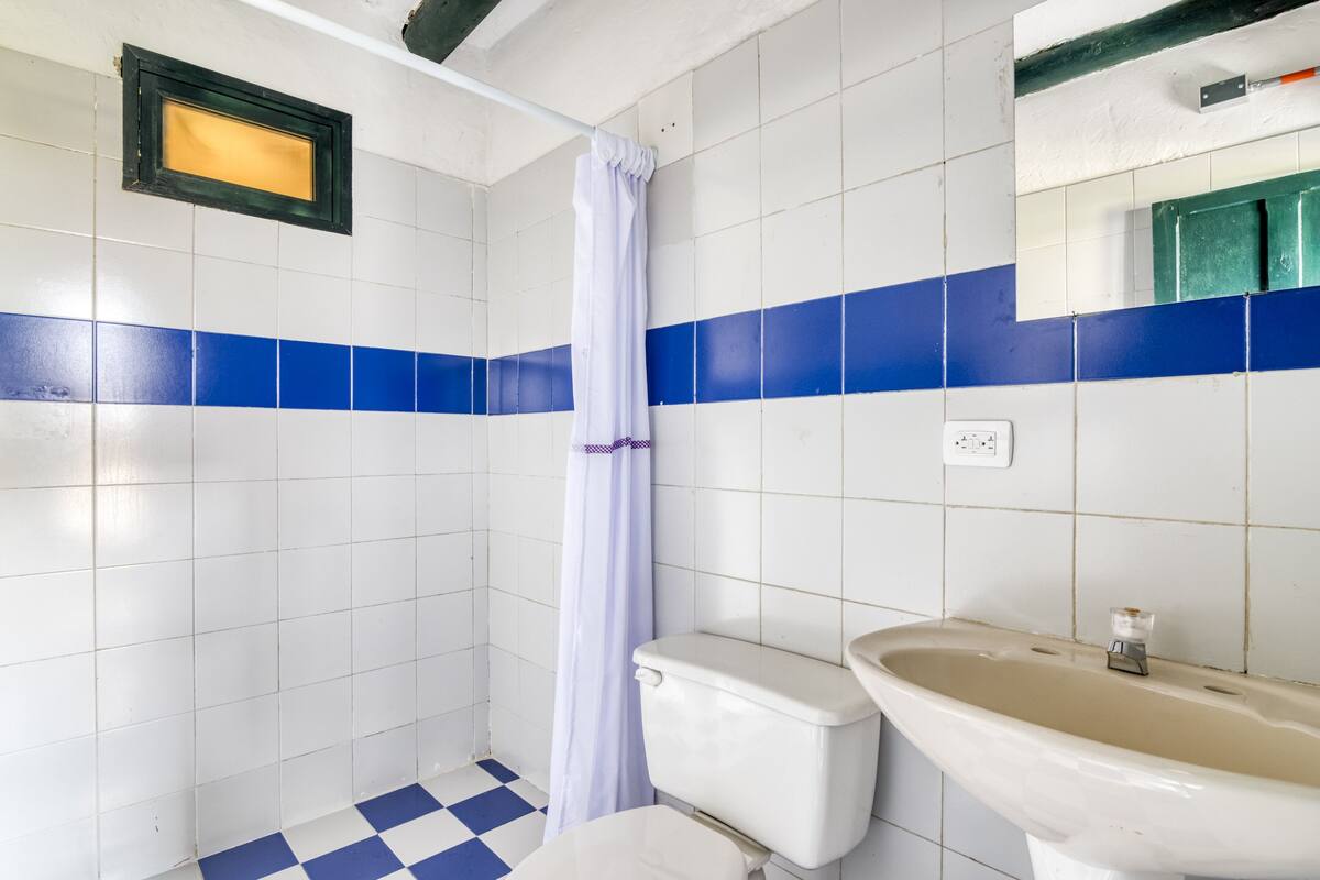 small room shared bathroom | bathroom | shower, towels