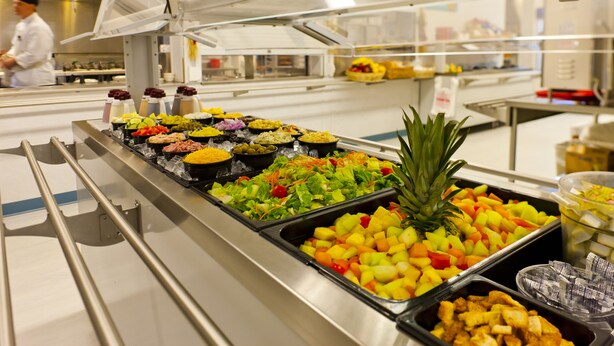A buffet with various food options including fruits, salads, and other dishes. - Target Hospitality - Mentone Skillman Station Lodge (Mentone)