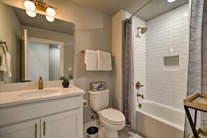 Bathtub, hair dryer, towels, soap