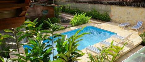 Outdoor pool, pool umbrellas, sun loungers