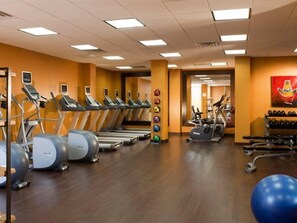 A gym with treadmills, elliptical machines, and exercise balls. - Marriott Plaza Santonio (San Antonio)