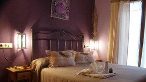A bedroom with a bed, pillows, a bedside table, and a lamp. - LILA-ROOM-Rural House Angelita (Olocau Del Rey)