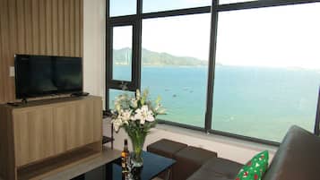 Luxury Apartment, 2 Bedrooms, Kitchenette, Beach View | Living room | 43-inch flat-screen TV with cable channels, Smart TV