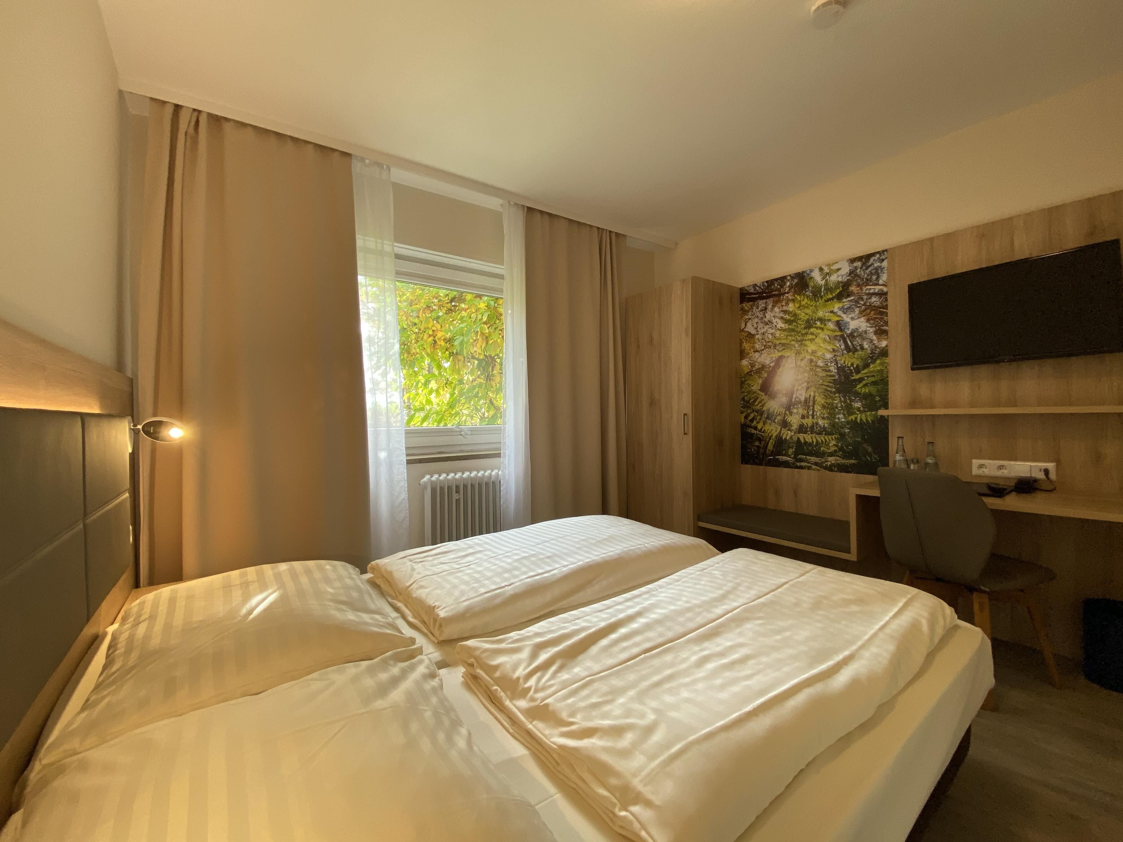 hypo-allergenic bedding, desk, blackout curtains, free wifi