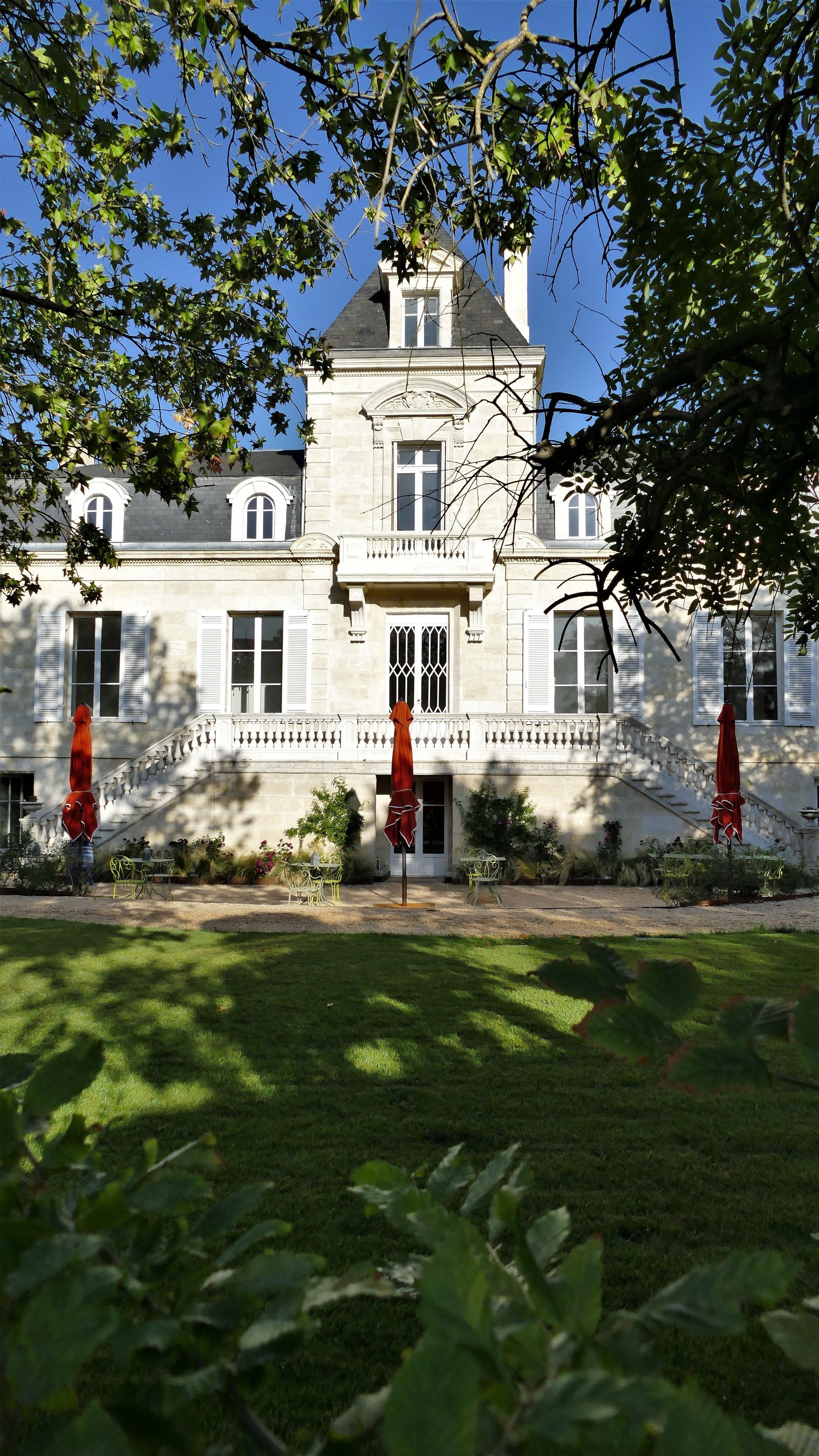 A large, stately building with a symmetrical facade, multiple windows, and a central entrance.