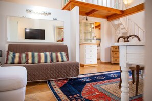 Apartment, 1 Bedroom | Living area | Flat-screen TV