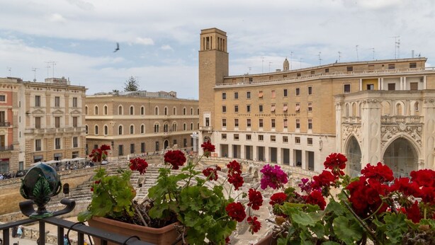 A historic building with a prominent tower and an ornate archway. - Italianway - Sant'Oronzo Apartment (Lecce)