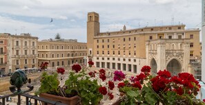 A historic building with a prominent tower and an ornate archway. - Italianway - Sant'Oronzo Apartment (Lecce)