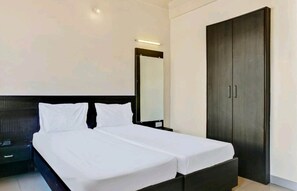 Deluxe Non Ac Room | Premium bedding, soundproofing, rollaway beds, bed sheets - Hotel Rose Lodge (Pune)