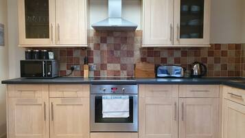 Classic Apartment, 2 Bedrooms | Private kitchen | Full-size fridge, oven, stovetop, cookware/dishes/utensils