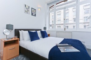 Appartement, 2 slaapkamers | Een strijkplank/strijkijzer, gratis wifi, beddengoed