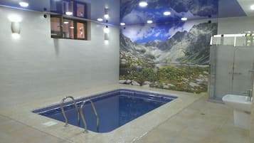 Indoor pool, seasonal outdoor pool, pool umbrellas, pool loungers