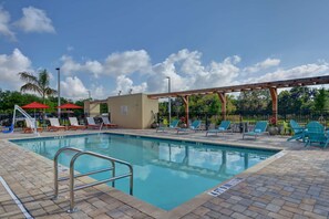 Outdoor pool, open 9:00 AM to 10:00 PM, pool loungers
