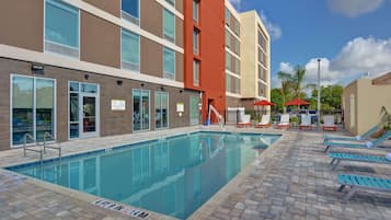 Outdoor pool, open 9:00 AM to 10:00 PM, pool loungers