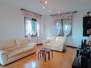 Apartment, 3 Bedrooms | Living area | 40-inch flat-screen TV with satellite channels, TV