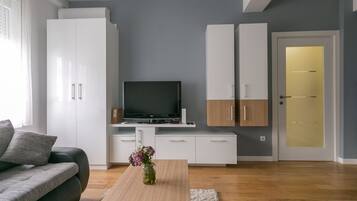 Apartment, 1 Bedroom | Living room | Flat-screen TV