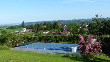 Seasonal outdoor pool, open 2:00 PM to 8:00 PM, pool umbrellas