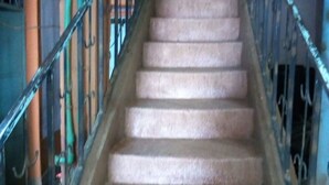 A staircase with metal railings leading to a door labeled "GROUND FLOOR". - Haricot Guest House (Murang'a)