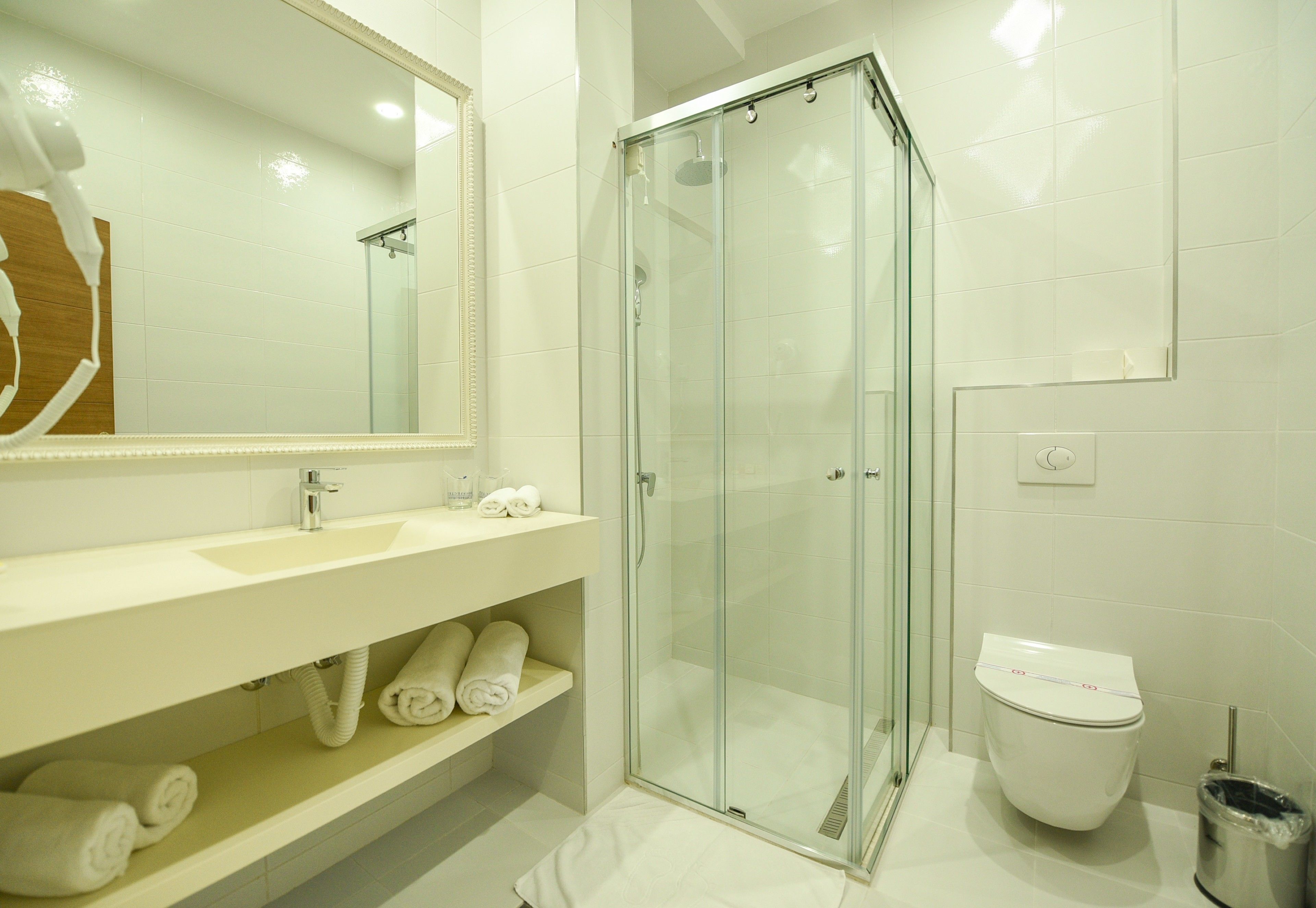 deluxe double room single use | bathroom | shower, free toiletries, hair dryer, bathrobes