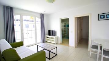 Economy Apartment, 1 Bedroom | Living room | 30-inch flat-screen TV with cable channels, TV