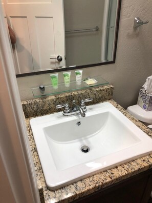 Combined shower/tub, hair dryer, towels, soap