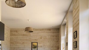 A modern kitchen with a central island, dark cabinetry, and a large window providing natural light. - the Grand Potager, a very beautiful calm and preserved environment (Mittainvilliers-Vérigny)