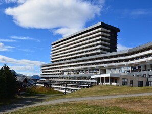 Stylish building with layered design and large windows.