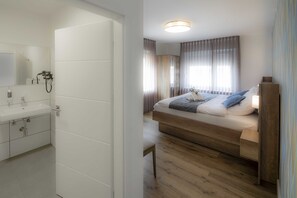 Habitación Deluxe doble, baño privado | 1 dormitorio