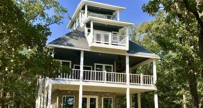 Tree Top Lake Views with lake access for swimming fishing boating 250 ft away!