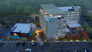 A hotel with a modern design, featuring a rooftop terrace and a parking lot. - AC Hotel Bridgewater (Bridgewater)