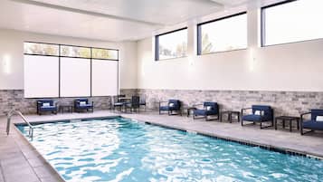 Relax by the pool with lounge chairs and a clear view of the water.
