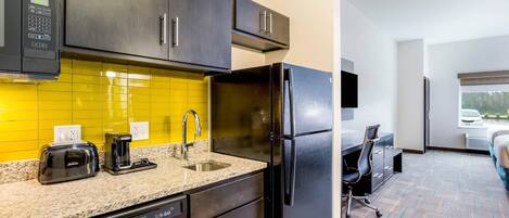 Suite, Multiple Beds, Non Smoking | Desk, laptop workspace, blackout drapes, iron/ironing board