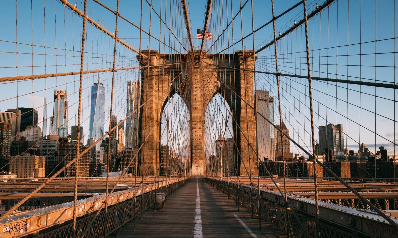 A bridge with a clear view of the city skyline in the background.