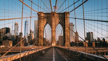A bridge with a clear view of the city skyline in the background.