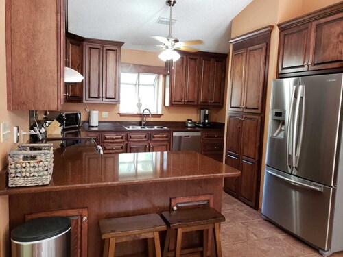 Private Getaway with Screened Pool, Upscale Kitchen, & Large Private Fenced Yard