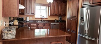 Private Getaway with Screened Pool, Upscale Kitchen, & Large Private Fenced Yard