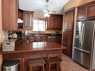 Private Getaway with Screened Pool, Upscale Kitchen, & Large Private Fenced Yard