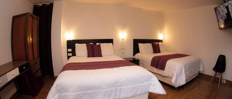 Family Quadruple Room | Down comforters, individually decorated, individually furnished, desk