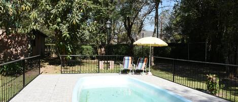 Outdoor pool, pool umbrellas, pool loungers