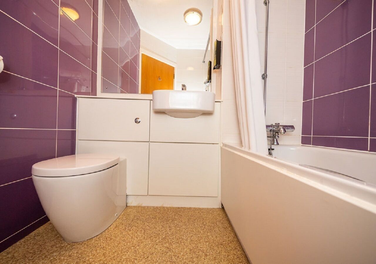 deep-soaking bathtub, hair dryer, towels