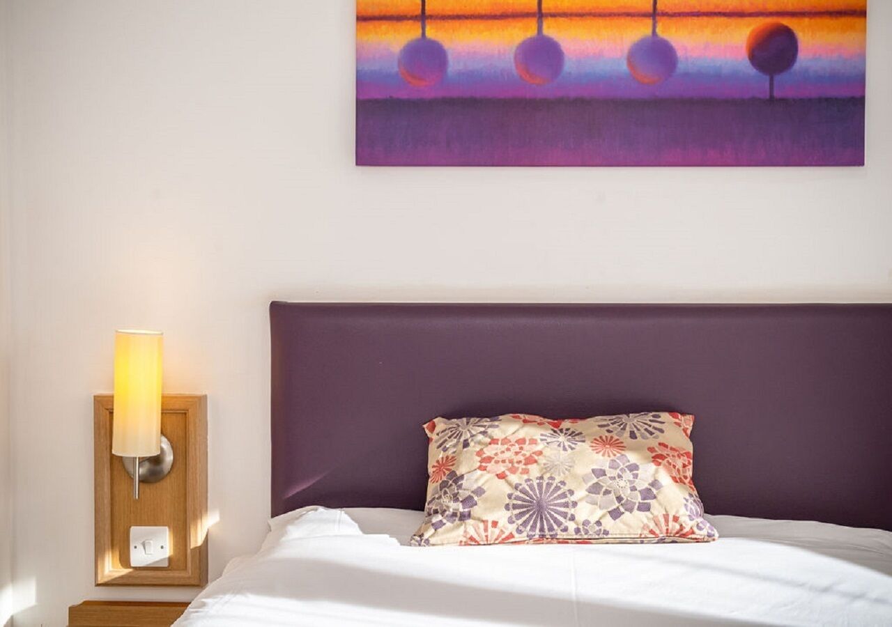 Desk, bed sheets, wheelchair access