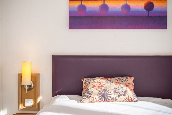 Desk, bed sheets, wheelchair access