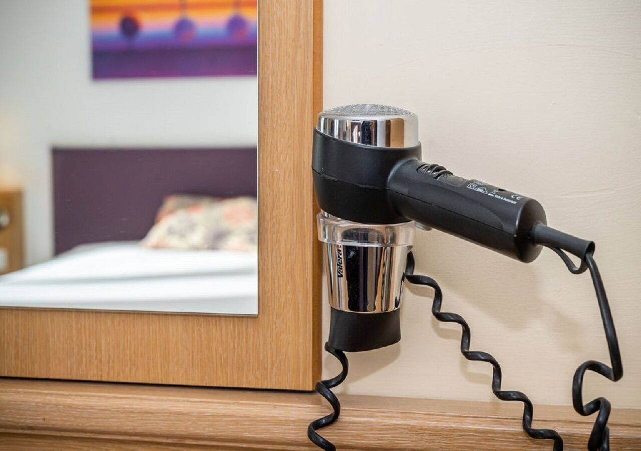 deep-soaking bathtub, hair dryer, towels