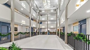A spacious indoor area with a high ceiling, multiple levels, and a central open space. - Mountain Lodge 1st Floor - Ski-in/Out - Mtn View - Pvt Parking (Snowshoe)