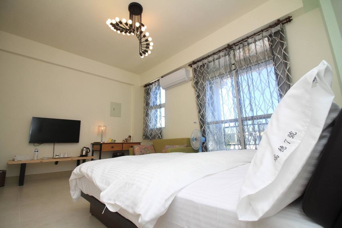 Desk, blackout curtains, bed sheets
