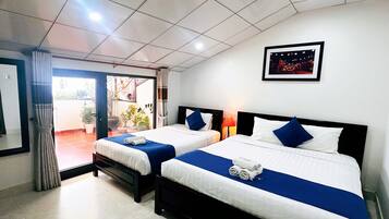 Deluxe Triple Room, City View | Premium bedding, pillow-top beds, minibar, in-room safe