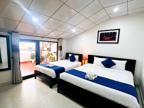 Deluxe Triple Room, City View | Premium bedding, pillowtop beds, minibar, in-room safe