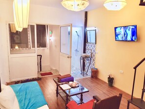 Apartment with Terrace - City View | Living area | 35-inch flat-screen TV with cable channels, TV - BC Family Homestay Apartment - Hanoi Old Quarter Center (Hanoi)